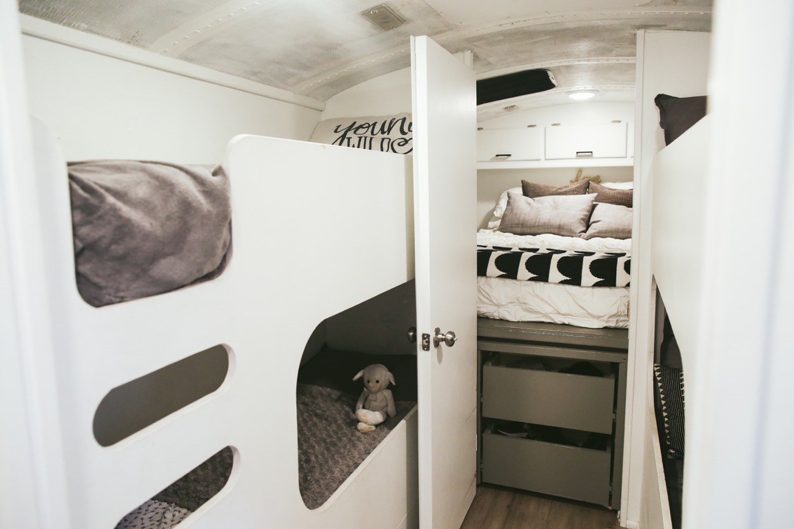 white bunk beds with grey bedding