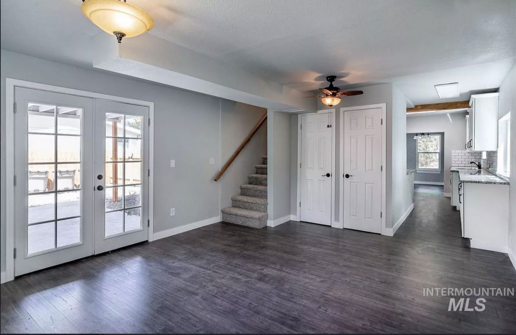 open plan living room with gray wood floors