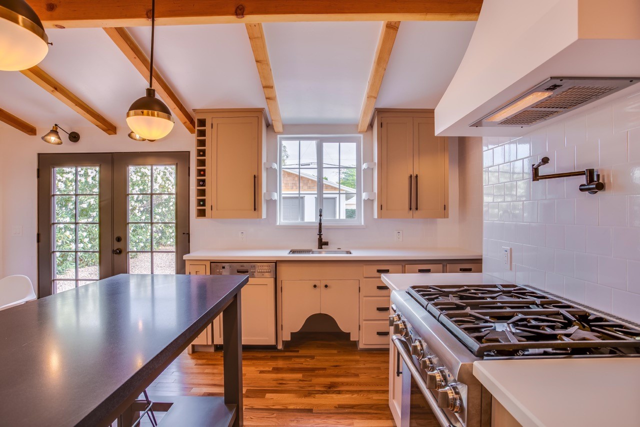 saloon-style cabinets hang underneath a sink