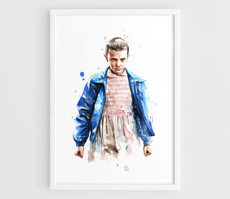 White framed art print of Eleven from Stranger Things. 