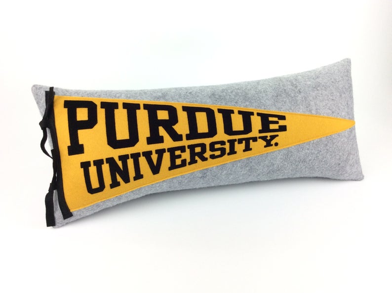 Gray and yellow pendant pillow with Purdue University on the front in yellow and black. 