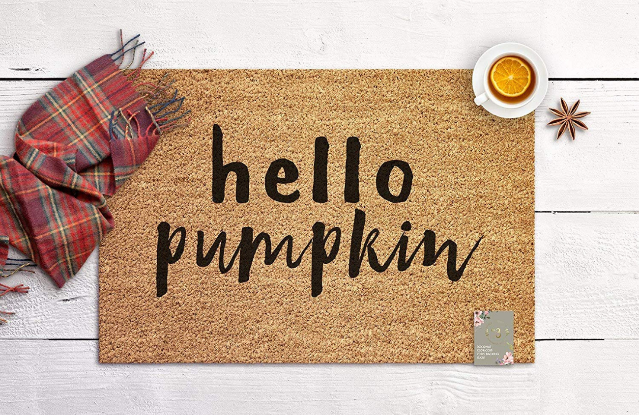 Jute welcome mat with "hello pumpkin" in black type.