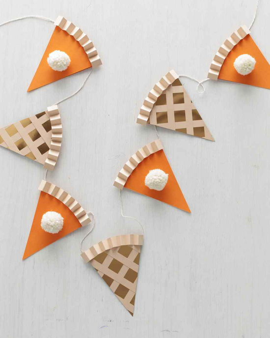 Pieces of pie made out of paper and attached by string to create a garland. 