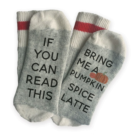 Thick socks in gray and white with a red stripe around the calf that read across the bottom of the feet, 'if you can read this bring me a pumpkin spice latte.