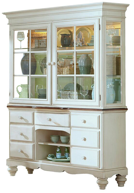 White china cabinet with plates and dishes inside.