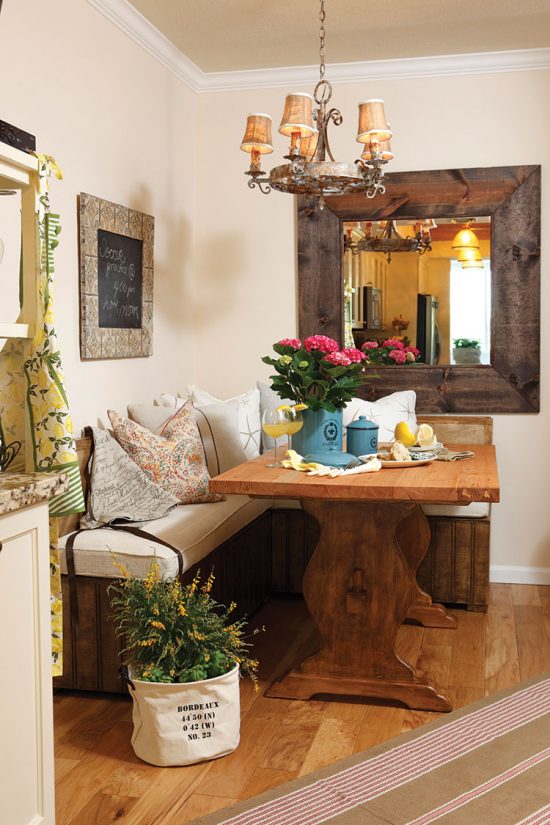 Country style banquette dining area and placed with fresh flowers. 