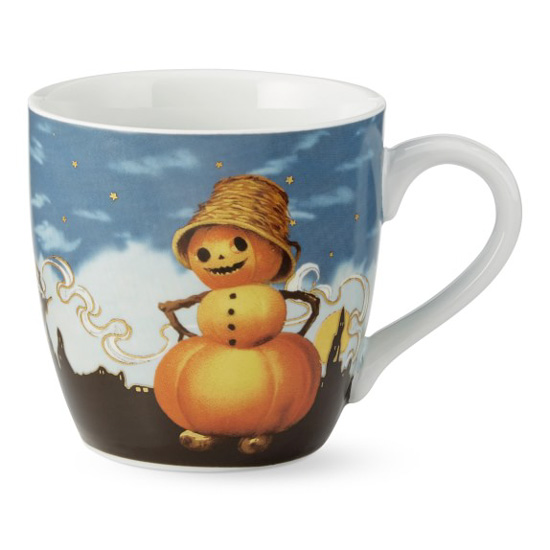 White porcelain fall mug with vintage image of a fall snowman made of pumpkins with a silhouetted city in the background.