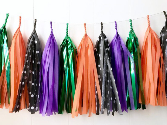 Tassle garland in shades purple, green, orange and black. 