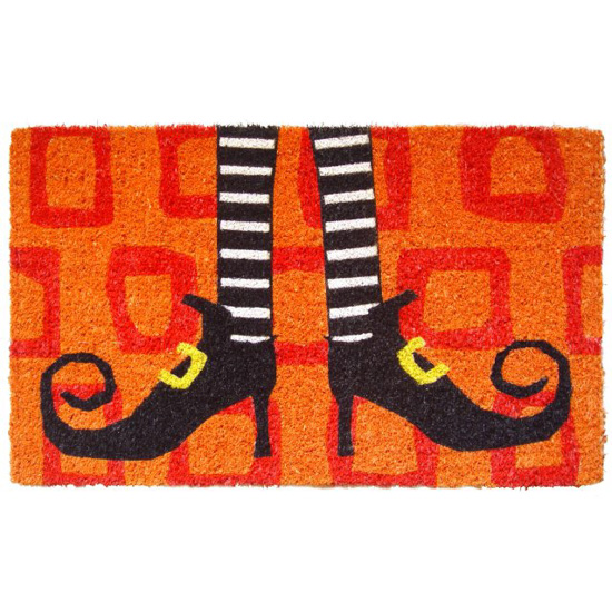 Halloween porch decor bright orange doormat with wicked witch shoes on it. 