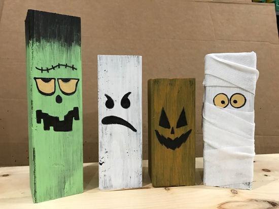 Hand-painted halloween characters on wooden 4x4s