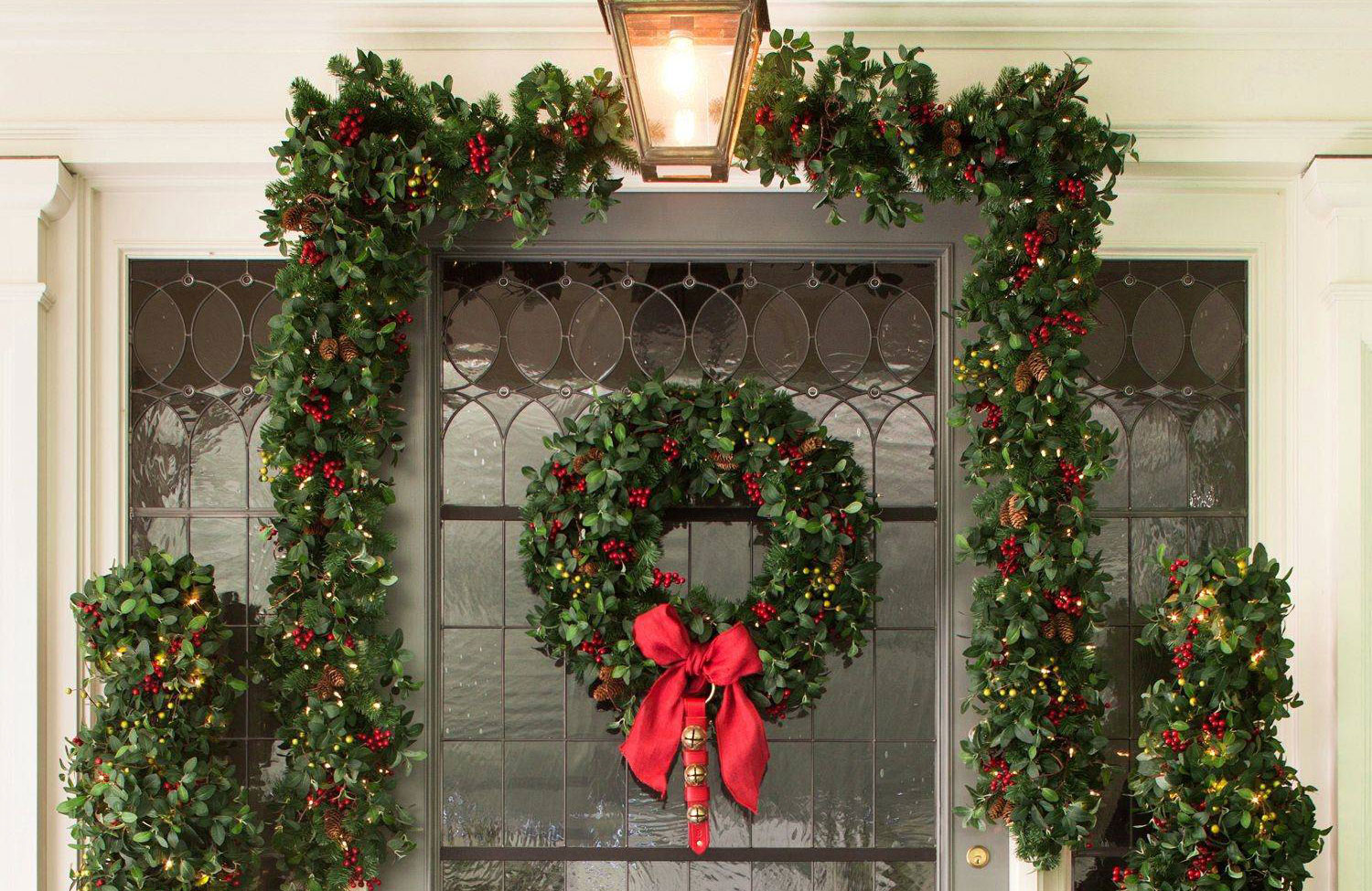glass-front door with matching wreath and garland