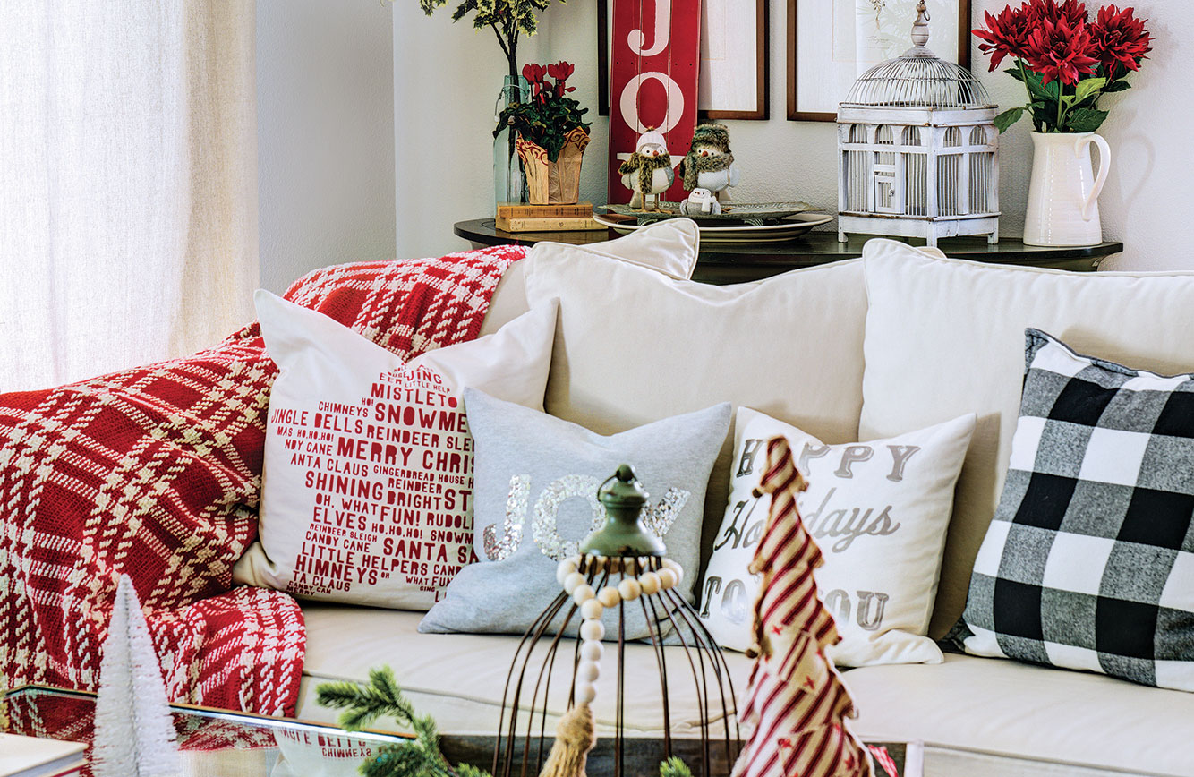 Colorful pillows, wall art and tabletop accents come together with fresh festive style in Jodi Kammerer's living room. Photo by Treve Johnson.