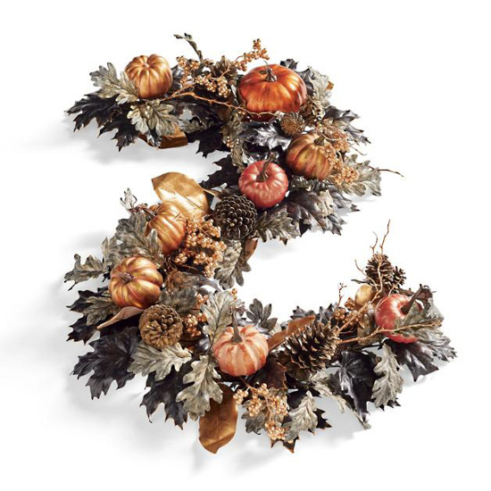 Fall garland with leaves, pinecones, twigs and small pumpkins. 