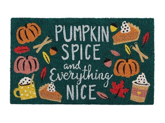 Green front doormat that says "pumpkin spice and everything nice" surrounded by drawings of pumpkins, cocoa filled mugs and slices of pumpkin pie. 