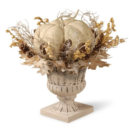 White and beige topiary filled with foliage and matching pumpkin.