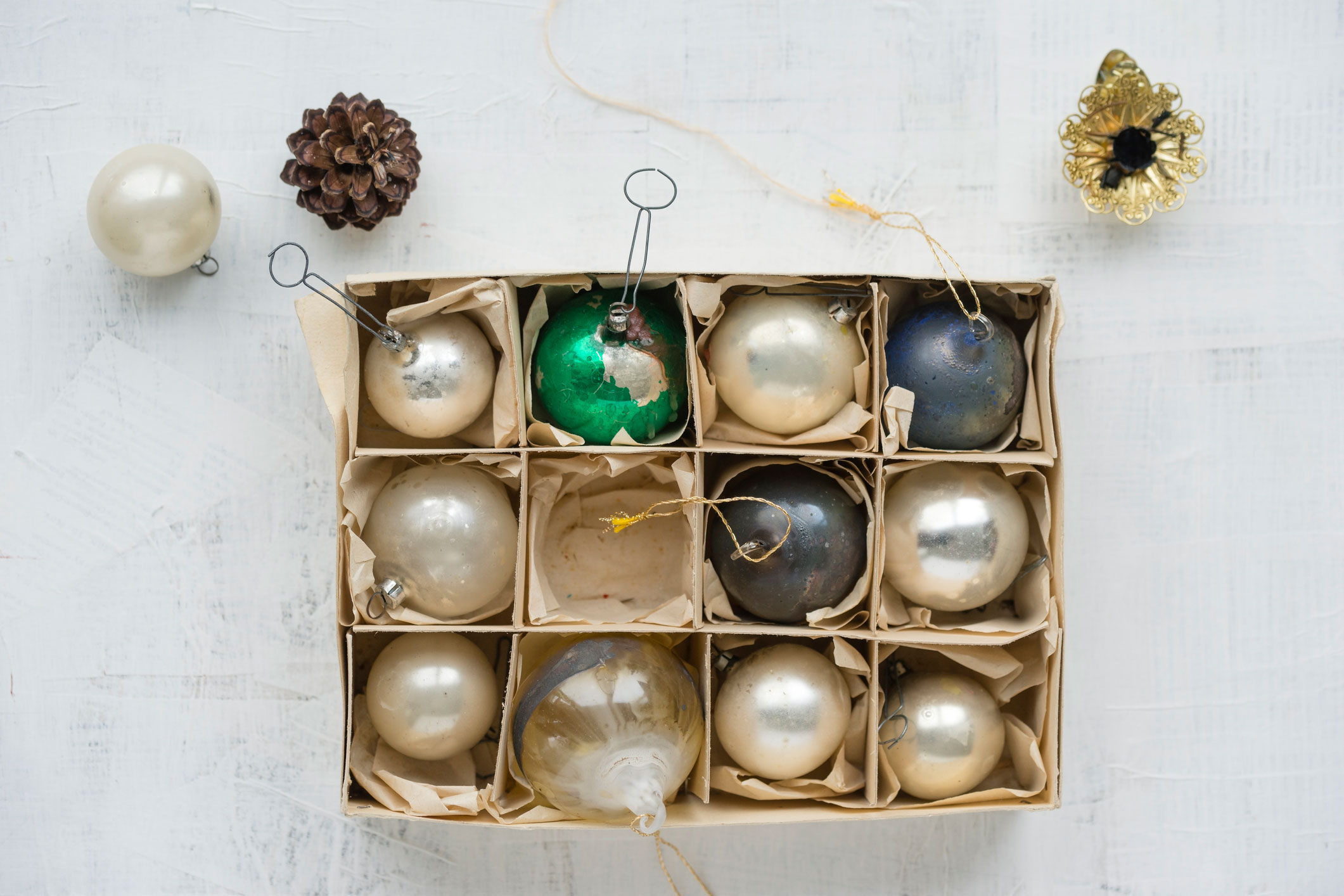 vintage ornaments organized in a box