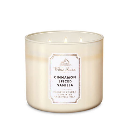 White wax, triple wick candle in frosted glass smelling like cinnamon spiced vanilla.