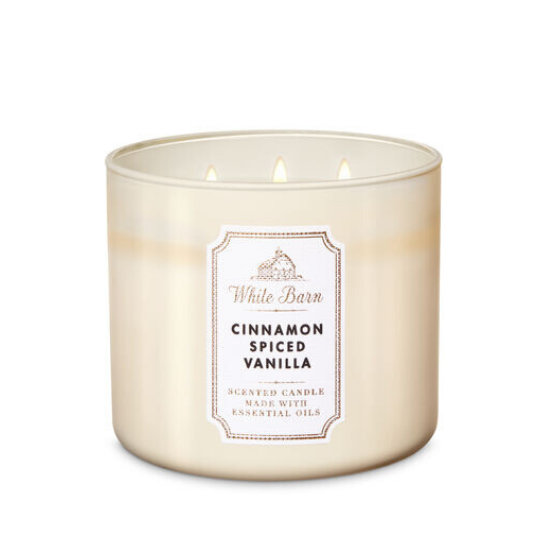 White wax, triple wick candle in frosted glass smelling like cinnamon spiced vanilla. 