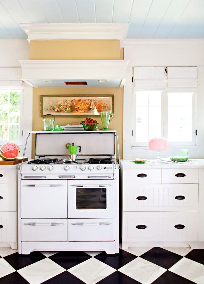 Vintage kitchen with retro appliances, checkerboard flooring, and a vintage stove