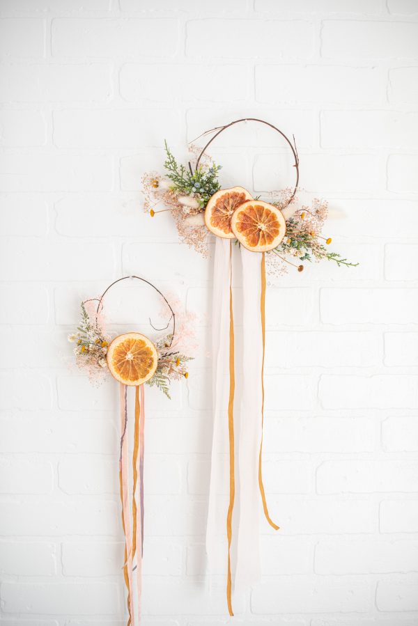 mini wreath decorated with dried flowers and citrus
