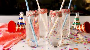 champagne flutes rimmed in colorful pop rocks