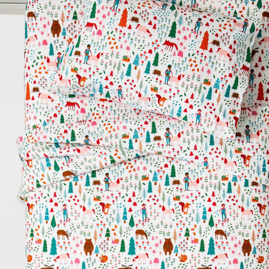 Colorful forest fun on kids flannel sheets.