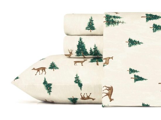 Cream colored flannel sheet set with roaming deer and pine trees. 