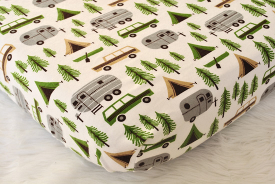 Camping themed fitted flannel crib sheet.