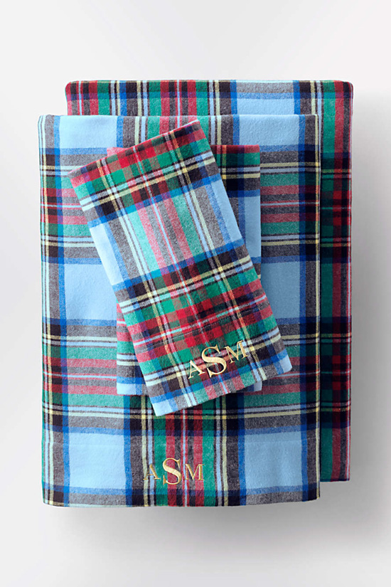 Christmas themed plaid flannel sheets with monogramming. 