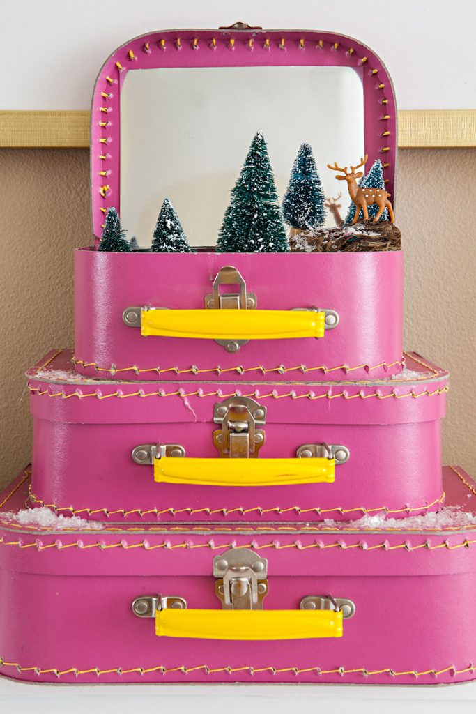 a holiday vignette in mini pink suitcases