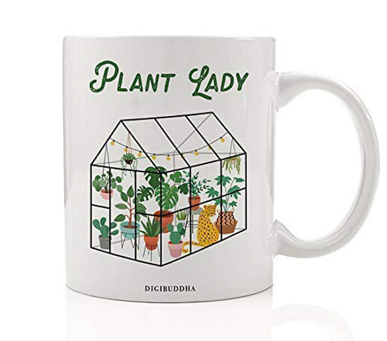 White ceramic mug with green house and "plant lady" decorated on one side. 