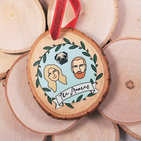 Personalized, hand-painted ornament with a small family painted on the front of a small wooden piece. 