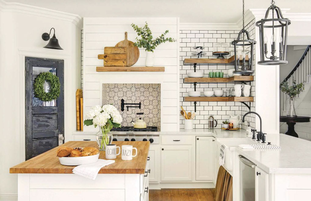 An old clock, a farmhouse table and a ladder add rustic charm to this beautiful dining room