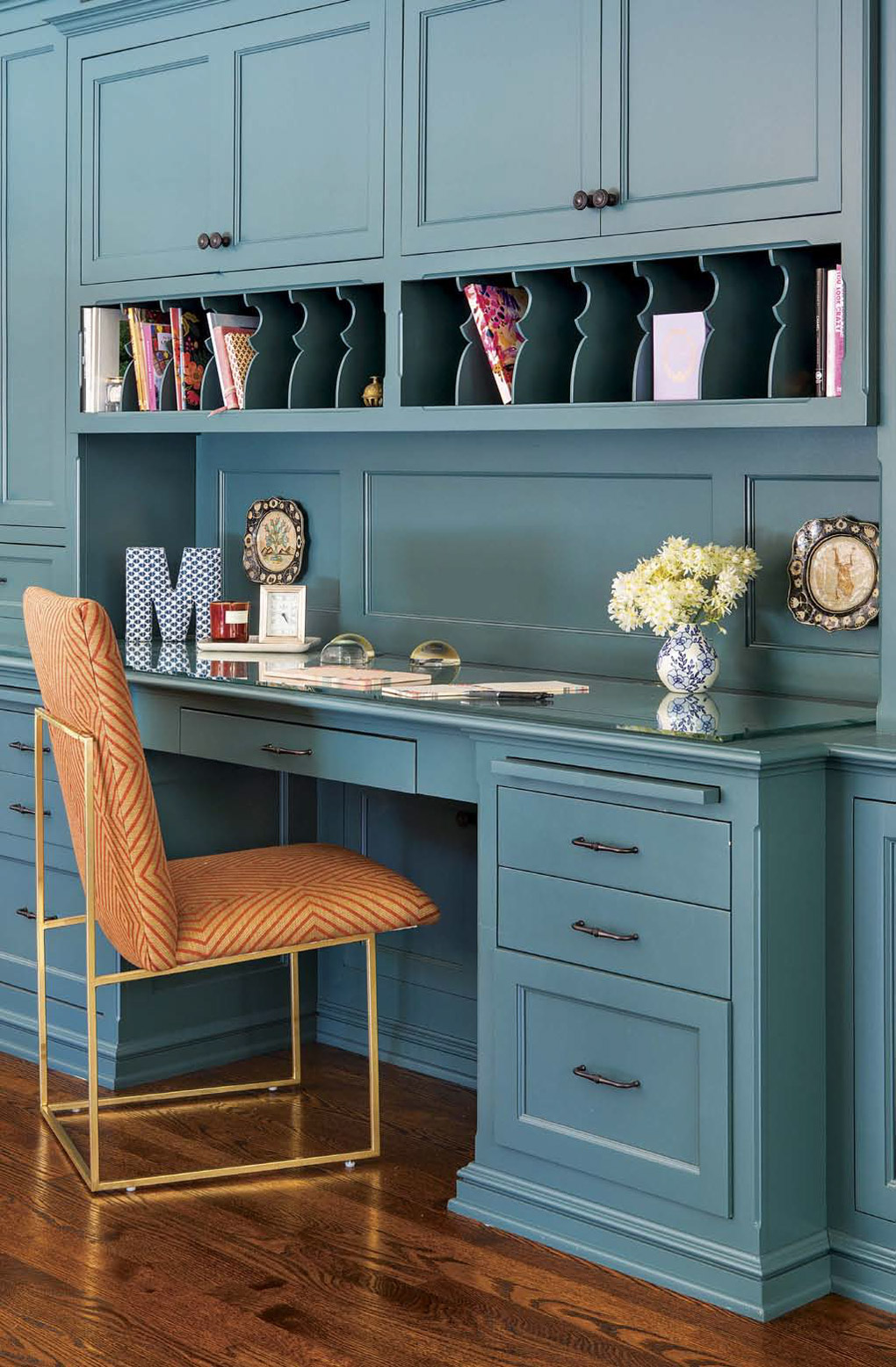 Custom made built-in desk and wrapping station in a bold shade of aqua. 