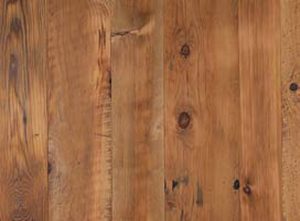Overhead shot of a slab of warm wood grain.