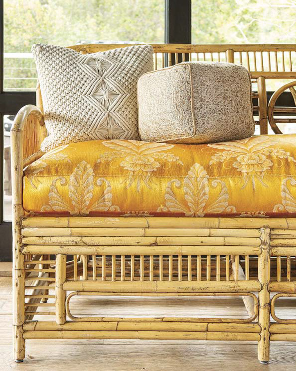 Rattan styled dining sofa with a 1940s satin cushion in butterscotch. 