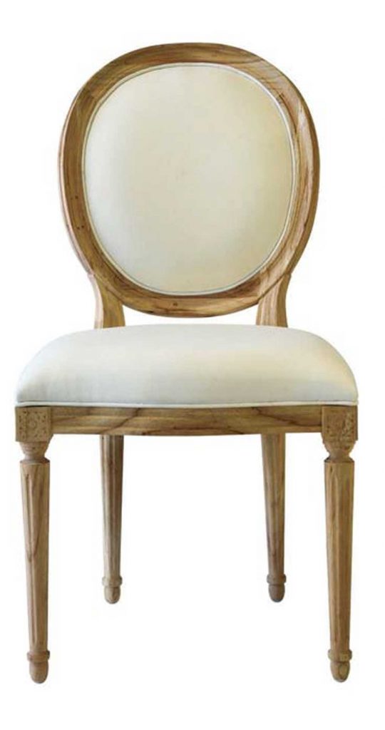 Round backed dining chair carved wood with cream colored upholstery.