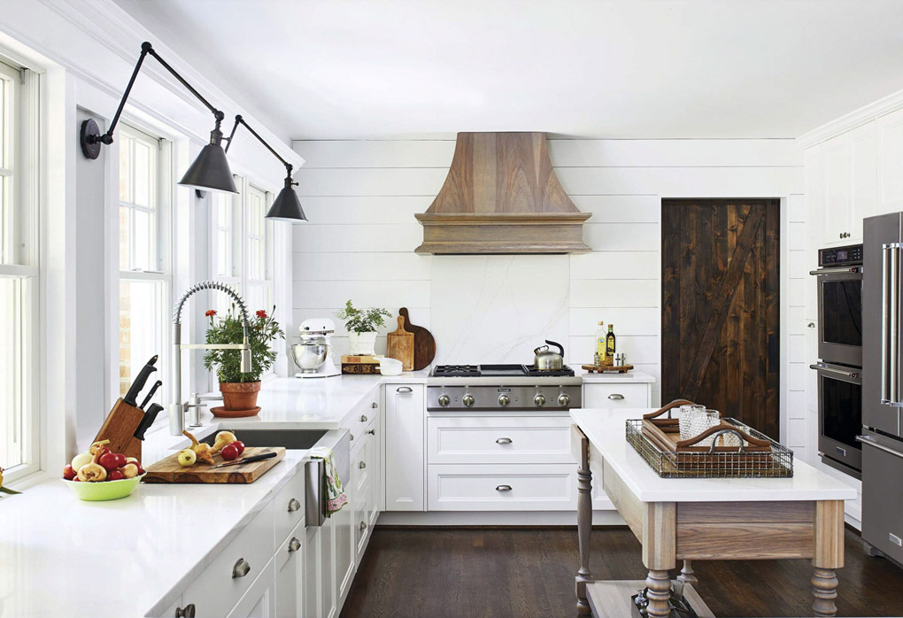 White modern farmhouse kitchen with custom free standing island. 