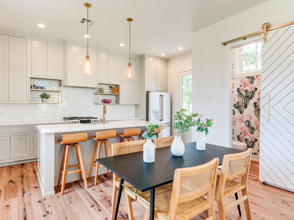 an open plan kitchen dining room designed by Scissortail Homes