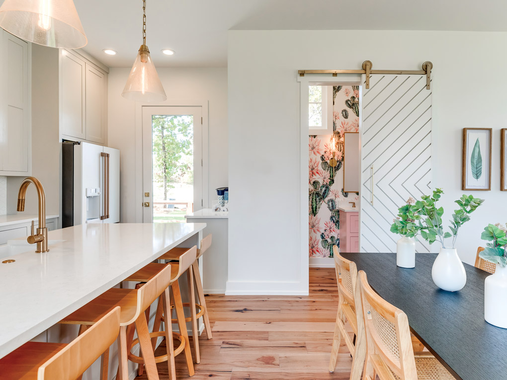 a veiw down the walkway between the open plan kitchen and dining room