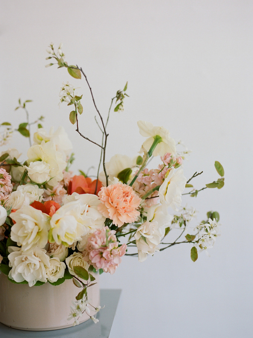Modern floral design in neutral tones with long whisps.