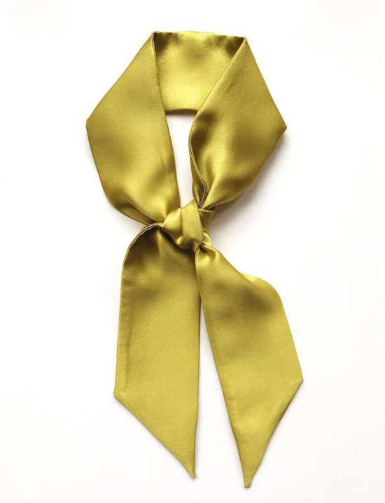 Chartreuse silk neckerchief, tied in a loop. 