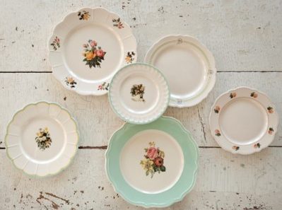 Vintage styled dishes in floral green and cream colors. 