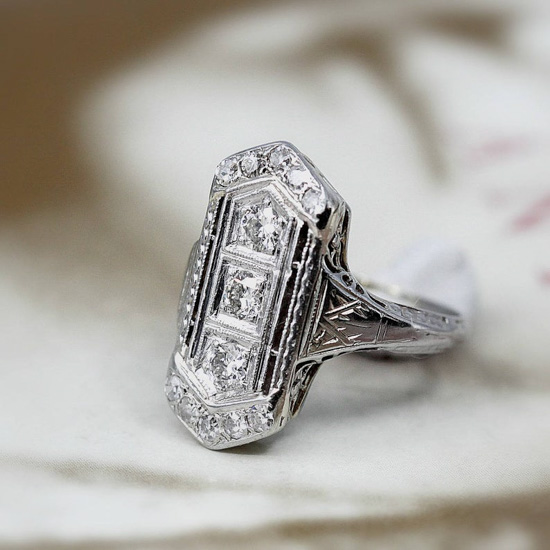 Antique white 18k gold ring in Art Deco styled setting.