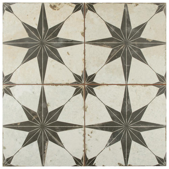 Four large off white tiles with a large gray starburst patterns. 