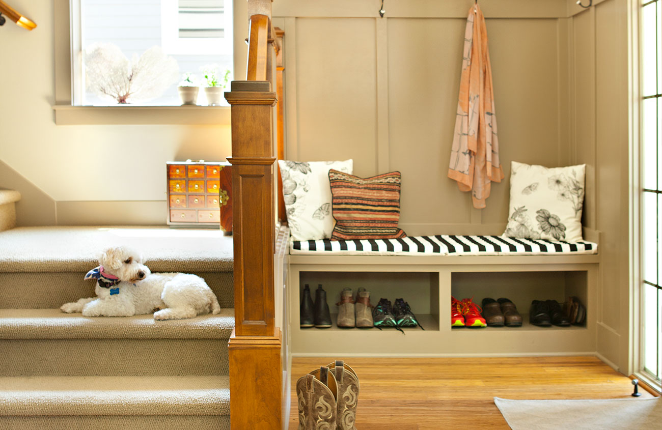 a built-in bench into her foyer to create a stylish but functional mudroom space.