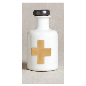Porcelain apothecary bottle with silver lid and gold cross design.