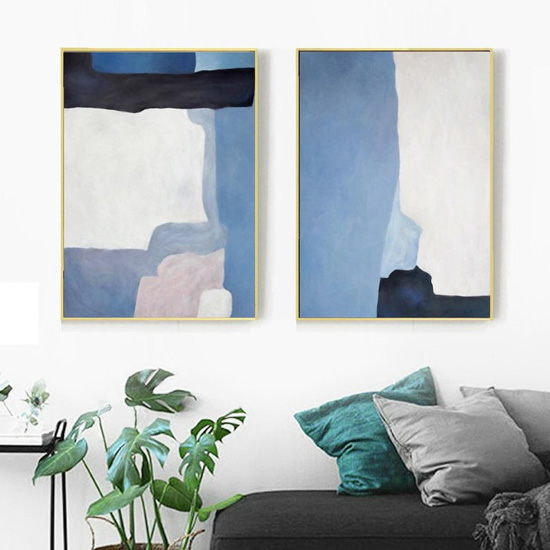 Large blue abstract watercolor wall art in gold frames.