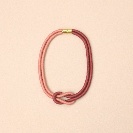 Two-toned necklace in shades of rose and blush with gold clasp. 