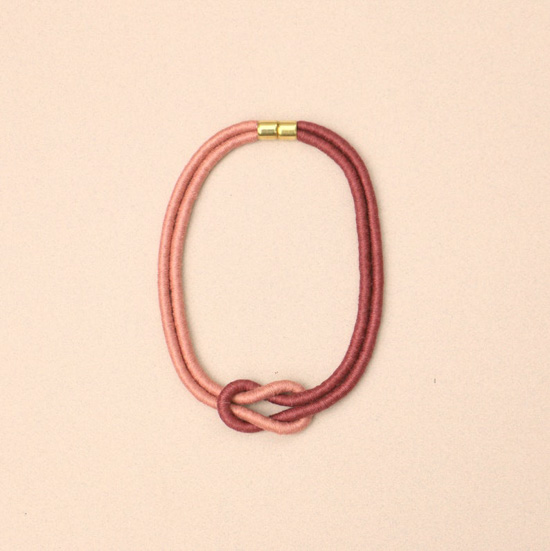 Two-toned necklace in shades of rose and blush with gold clasp.